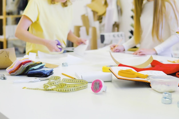 two-beautiful-women-working-together-workplace-workshop-concept-small-business-creativity_87743-480.jpg